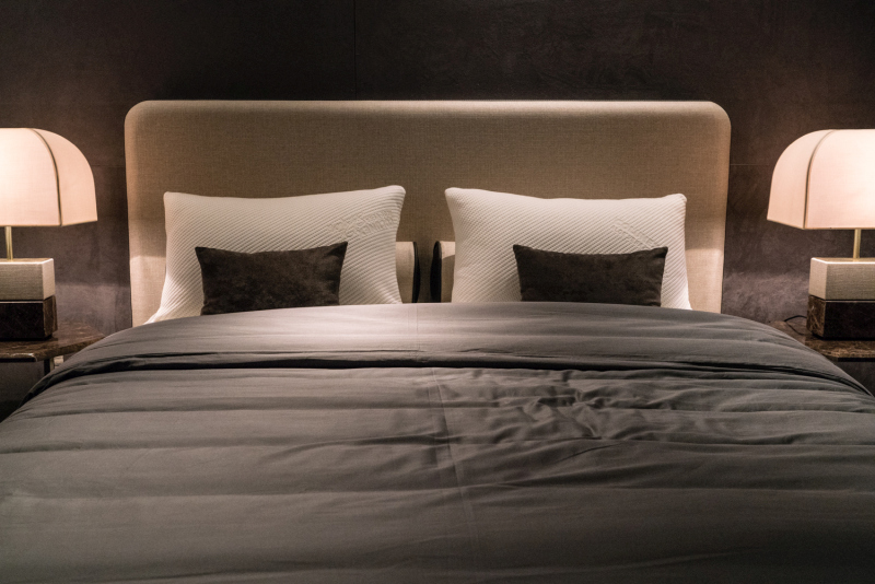 Matching Lamps Can Frame a Bed Without Copying Its Details