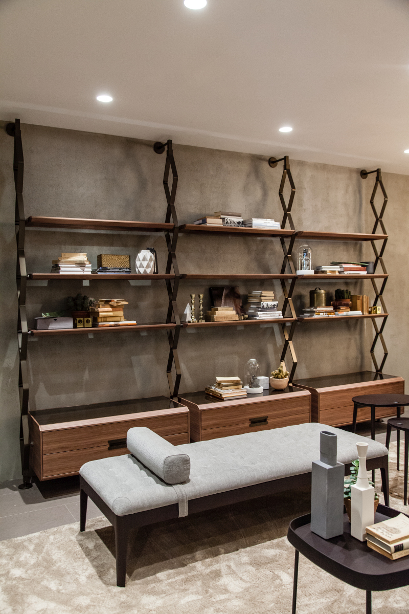 Metal supports give wall storage an exposed structure