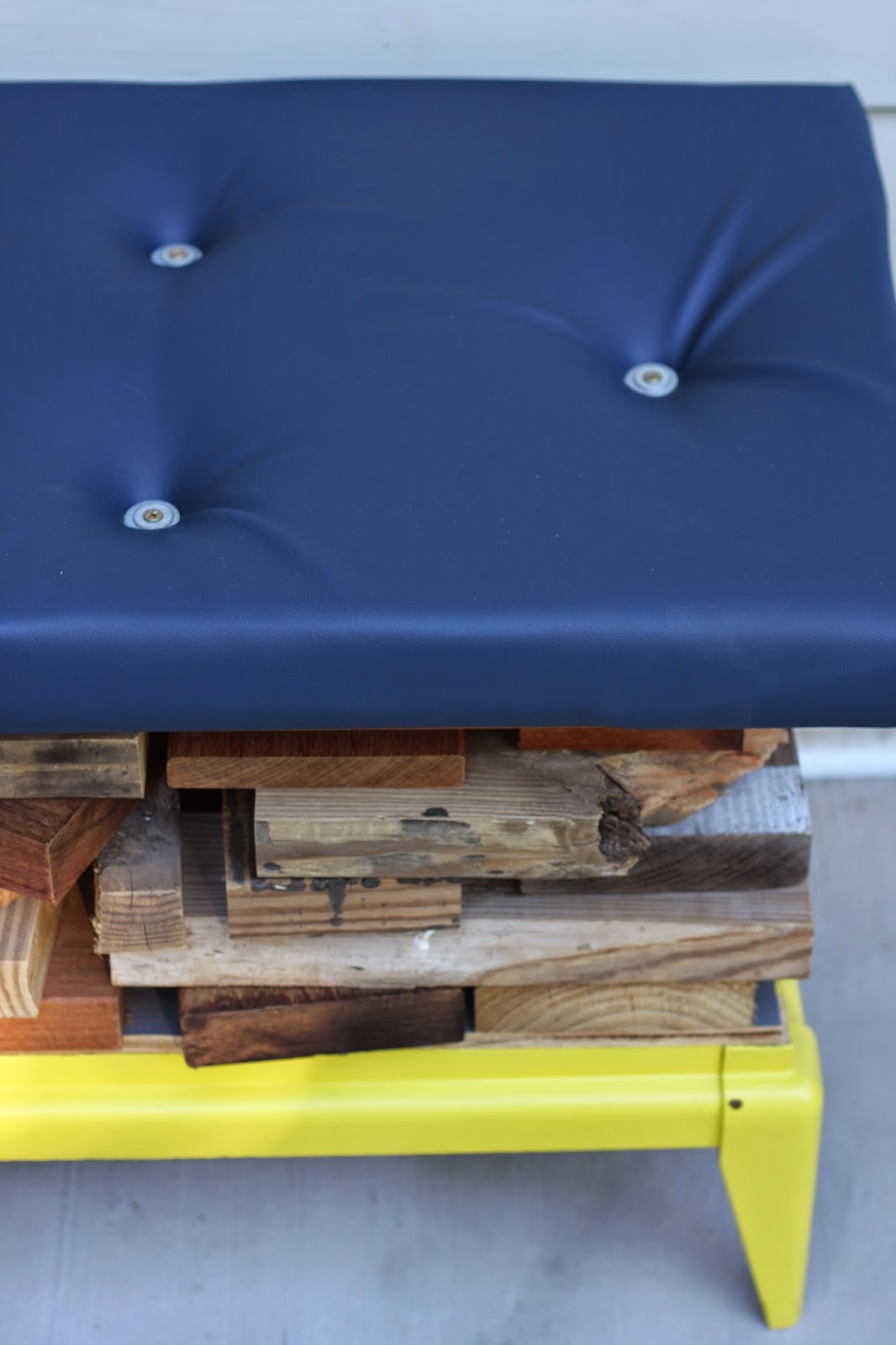 Navy vinyl hides the plywood seat