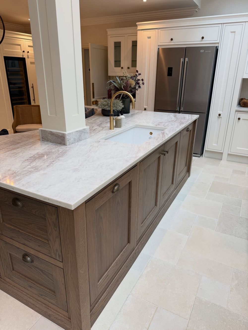 Oak Cabinetry Wraps Around the Column