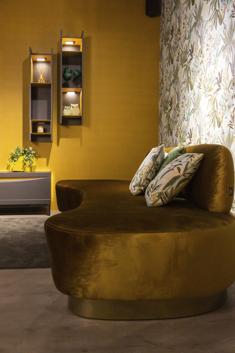 Olive Velvet Absorbs Light Across a Low Lounge Seat
