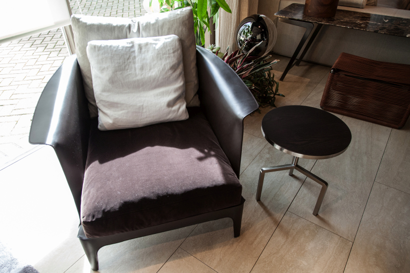 One Chair Combines Leather, Fabric, and Loose Cushions