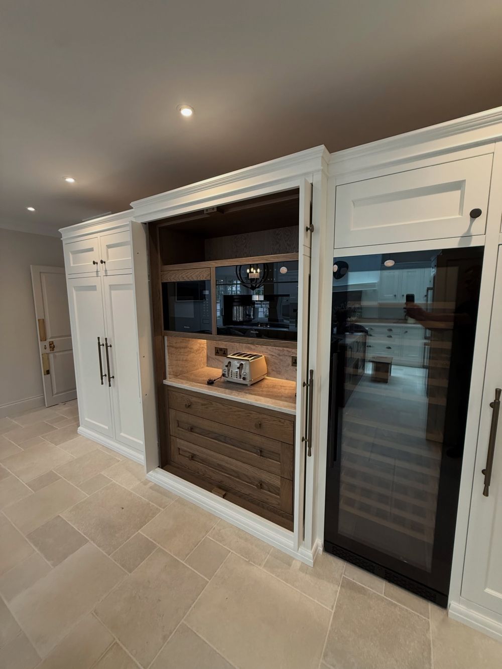 Opening the pocket doors exposes an oak-lined interior w