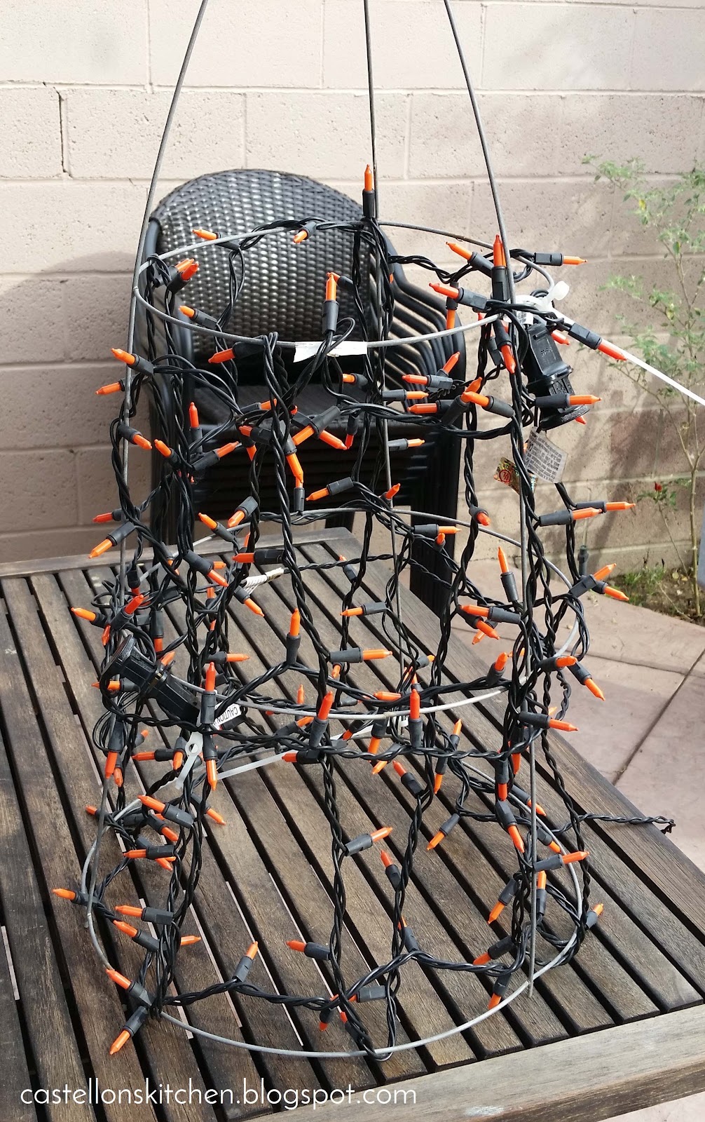 Orange Lights Follow the Tomato Cage’s Frame