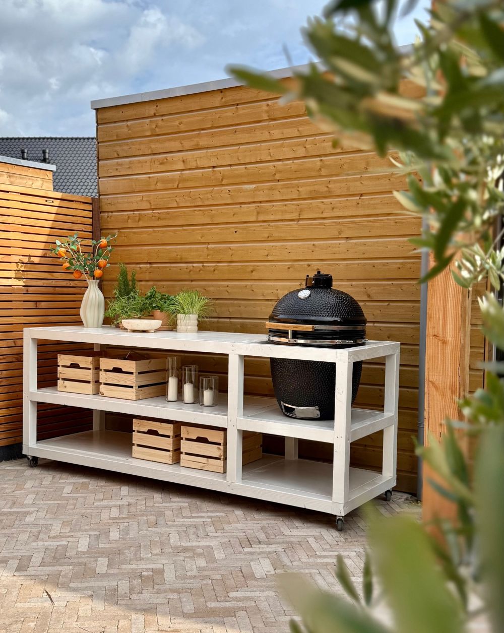 Outdoor Kitchen Sat Against the Timber Wall