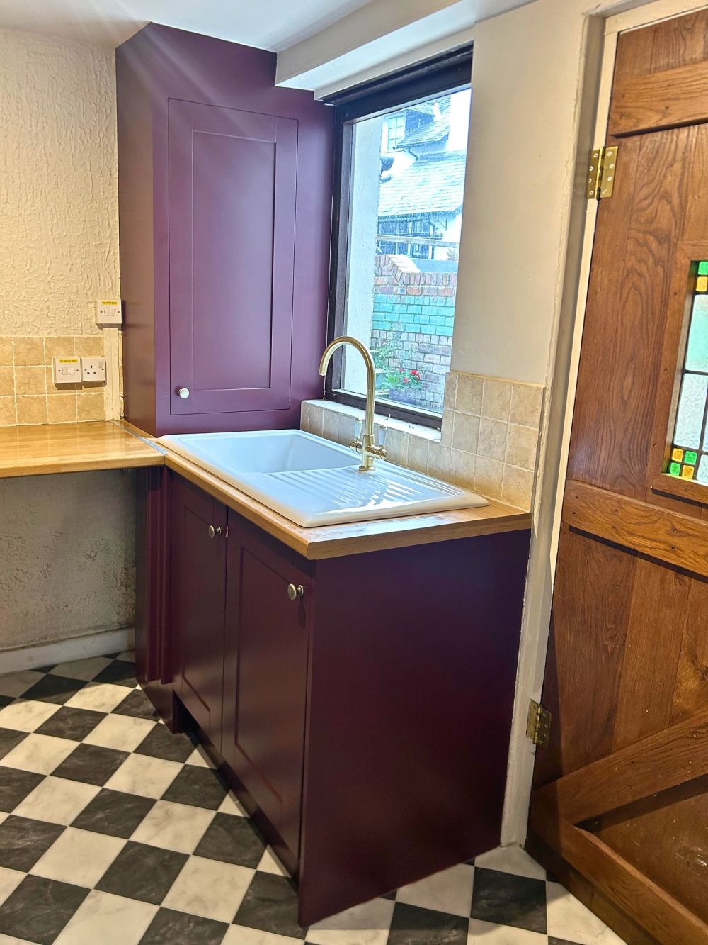 Painted shutters carry the color above the countertop