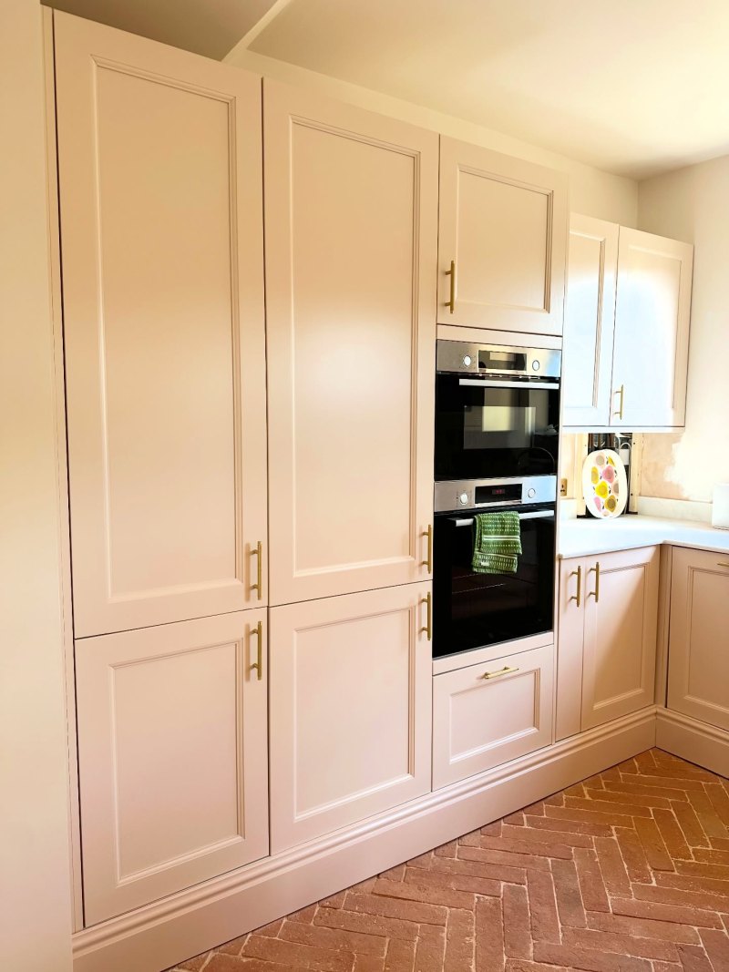 Pink Ground Extends Across the Tall Cabinets
