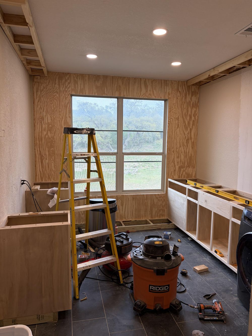 Plywood Turned the Bare Walls Into Cabinet Foundations