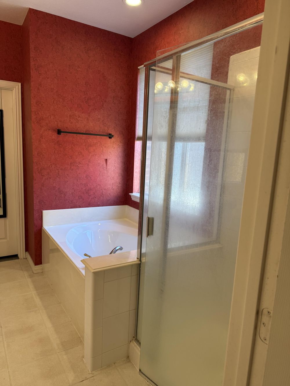 Red Walls, White Cabinets, and an Oversized Bathtub
