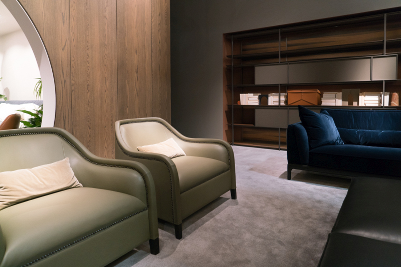Sage Leather Chairs Face a Navy Velvet Sofa