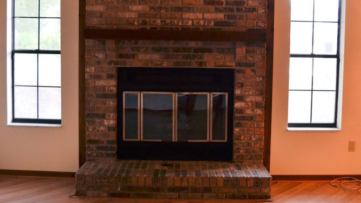 She Couldn’t Afford to Replace Her Dark Brick Fireplace, So She Used Leftover Trim Paint
