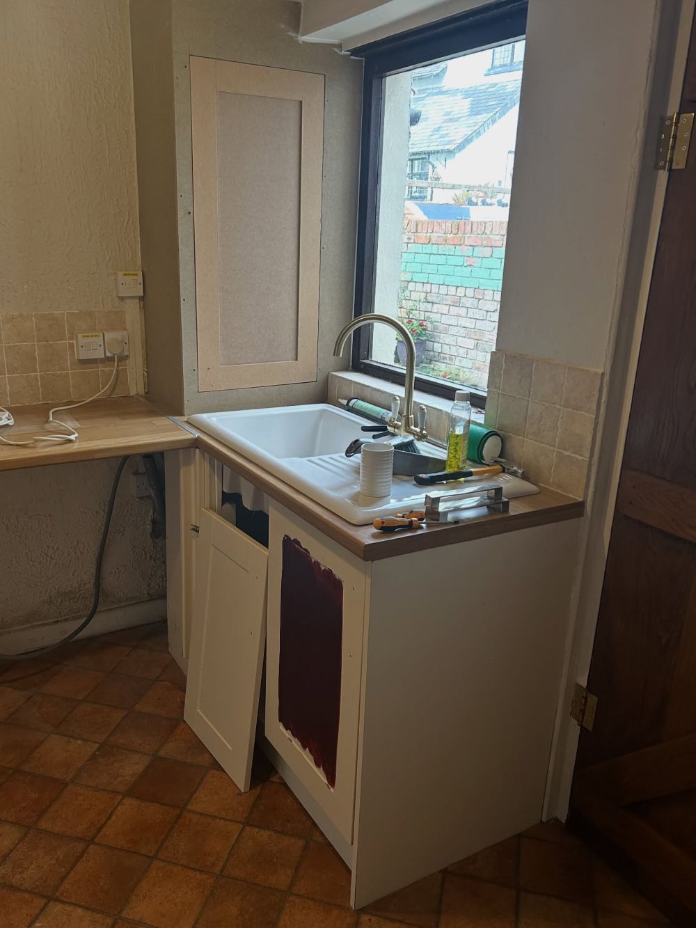 Sink cabinets kept their position beneath the window