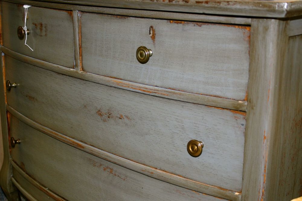 Six brass-colored knobs replaced the old hardware