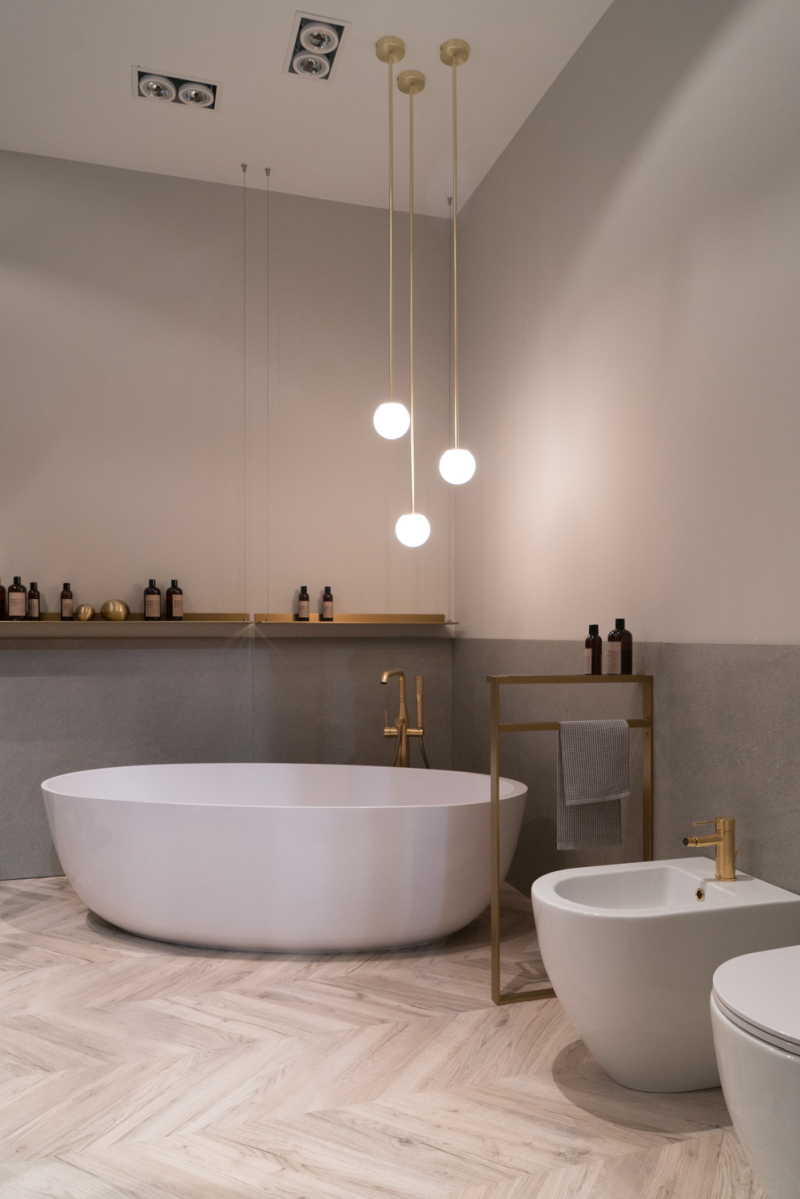 Staggered Globe Pendants Mark the Bathing Area