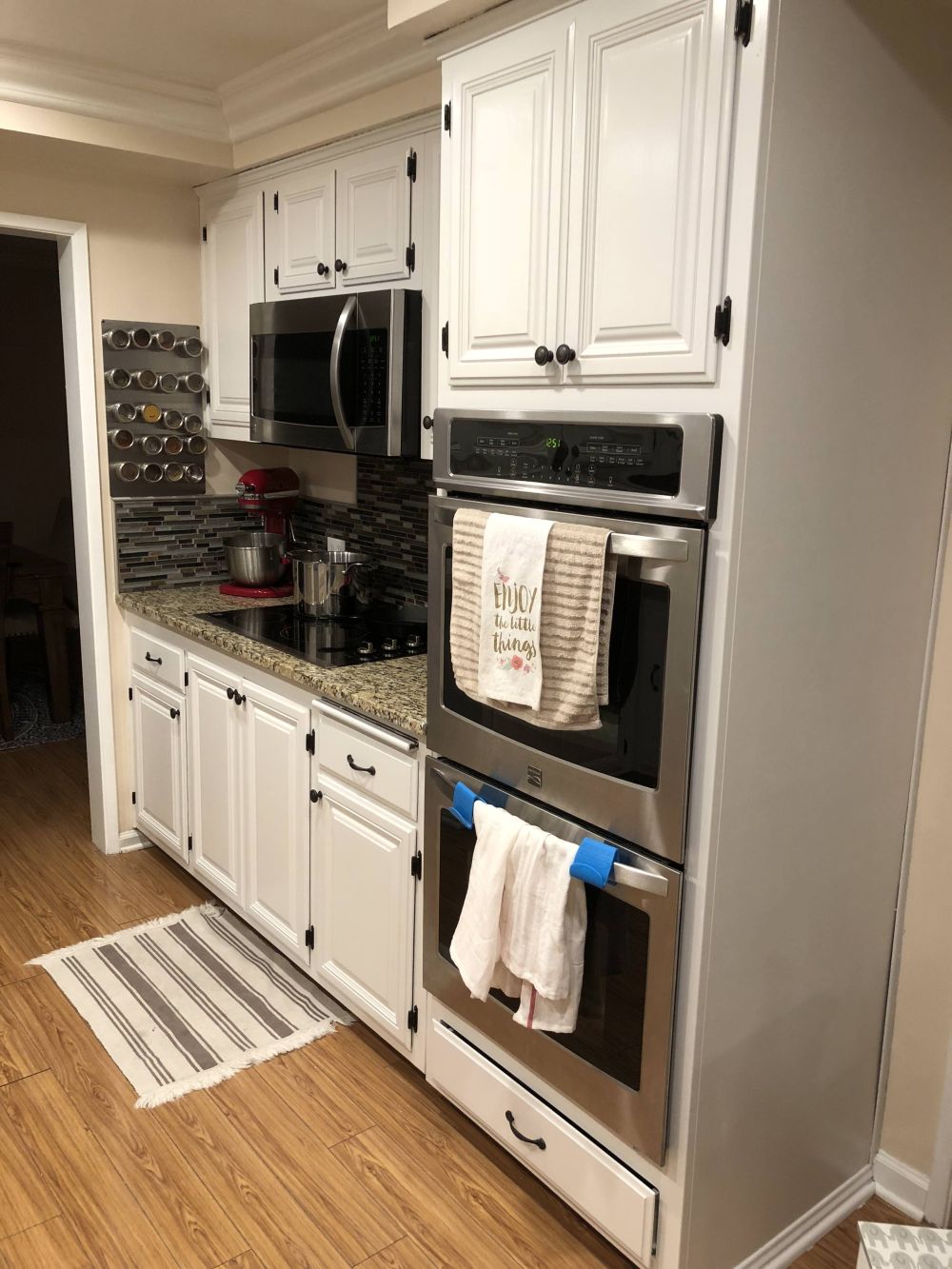 Tall Cabinetry Framed the Appliances in White