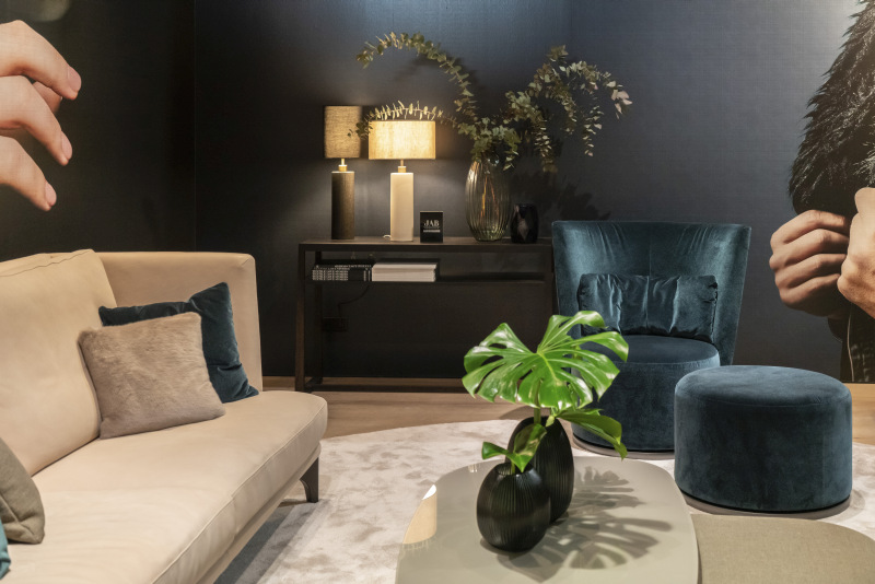 Teal Velvet Creates Its Own Seating Corner Beside a Cream Sofa