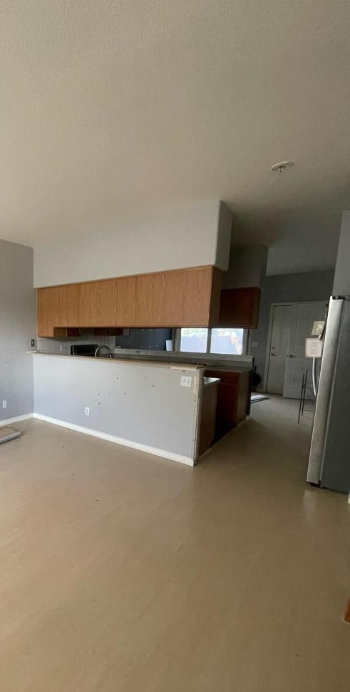 The Living Room Faced a Long Row of Suspended Cabinets