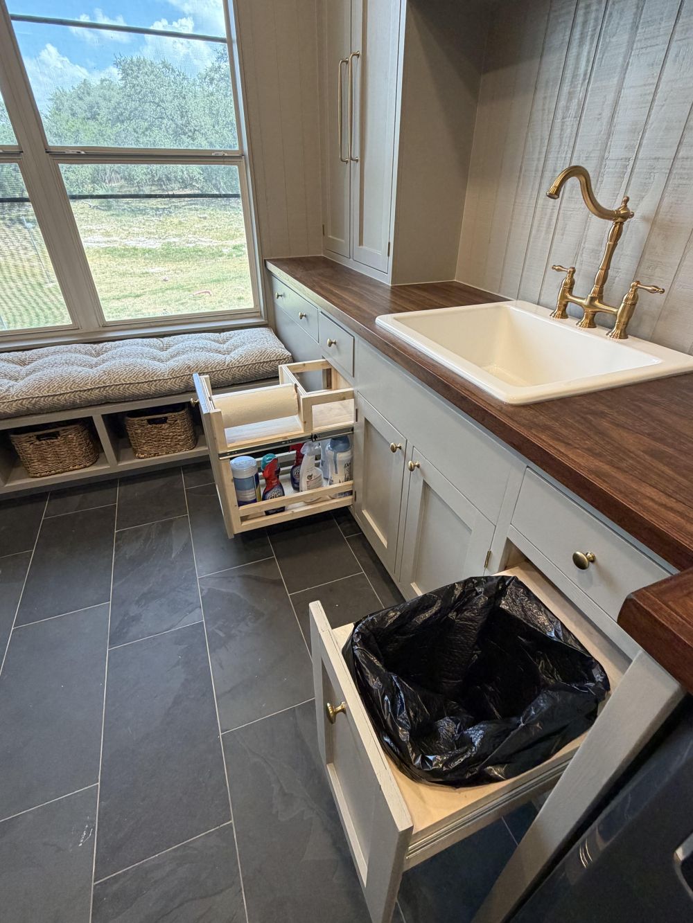 The Sink Cabinets Hide Pull-Out Cleaning Storage