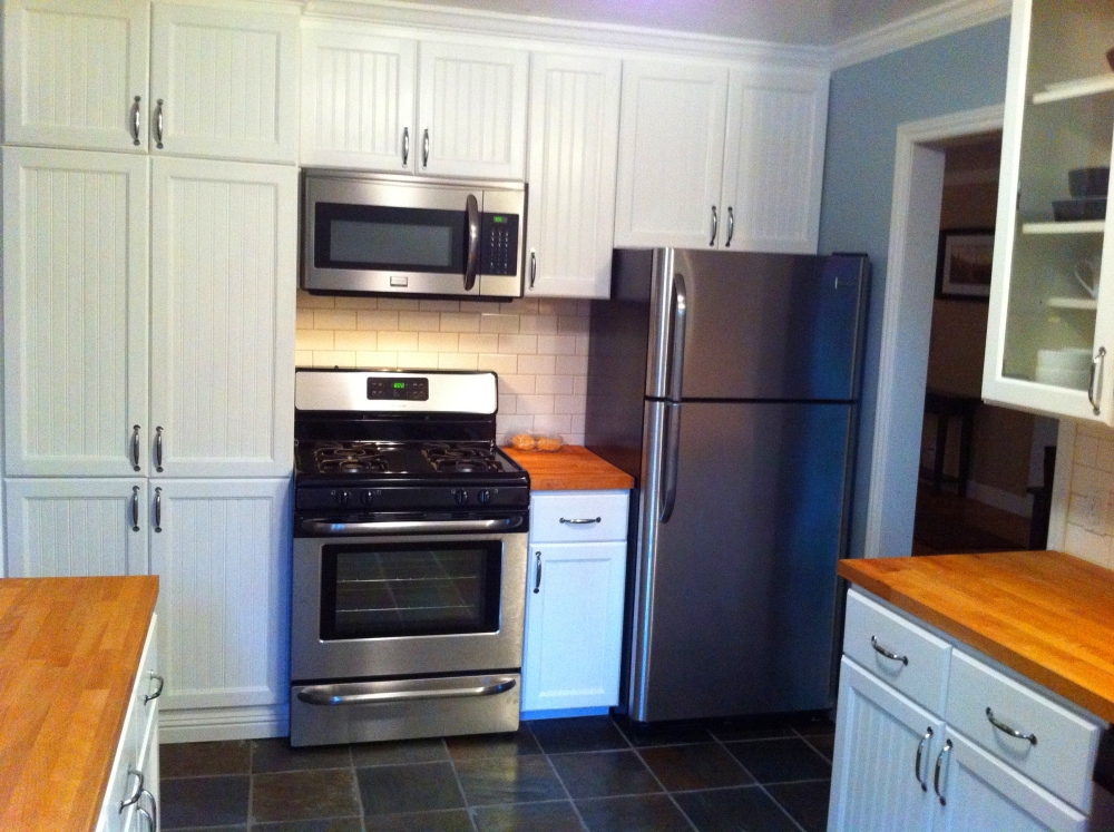 The finished cooking wall gained storage around the appliances