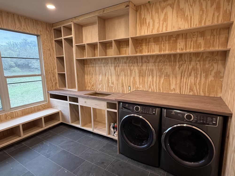 The washer and dryer fit beneath a