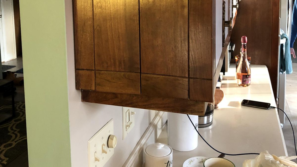 They Discovered a Secret Sliding Panel Behind Their Kitchen Cabinets, but Nobody Knew What It Was For