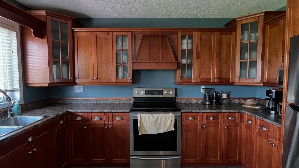 They Painted Their Brown Wood Cabinets Worldly Gray and the Kitchen Looks Like a Different Home