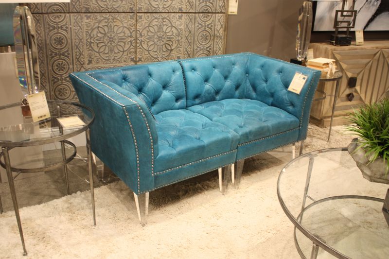 Velvet, tufting, and nailheads can turn a sofa into the room's focal point