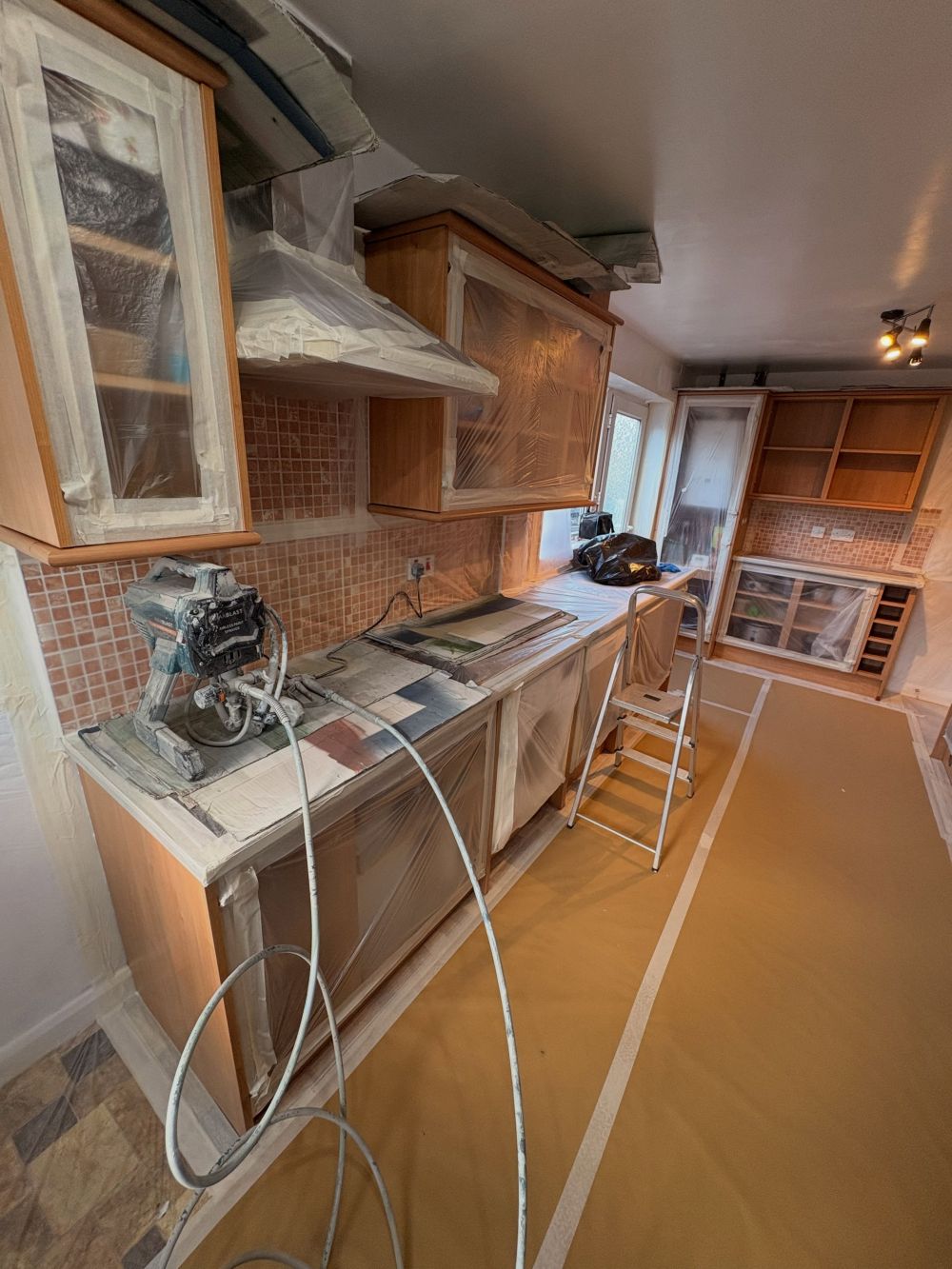 Wood Cabinets Filled Both Sides of the Galley Kitchen