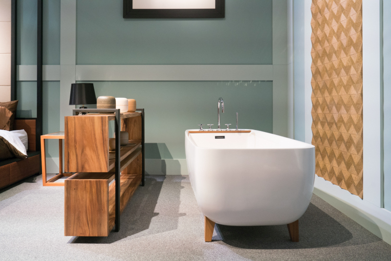 Wood Feet Connect a White Tub With Nearby Storage