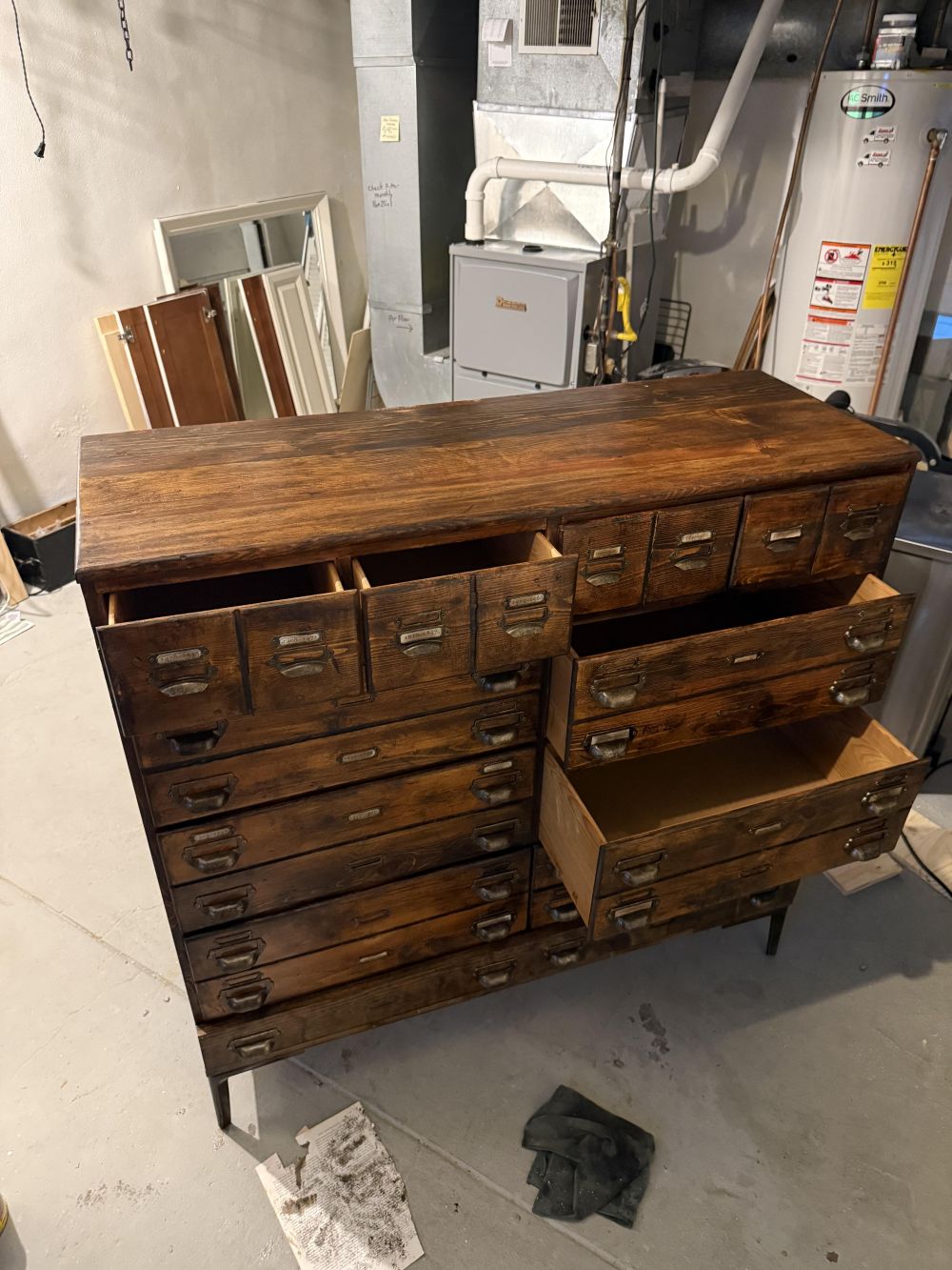 completed piece has eight small-looking drawers along the top