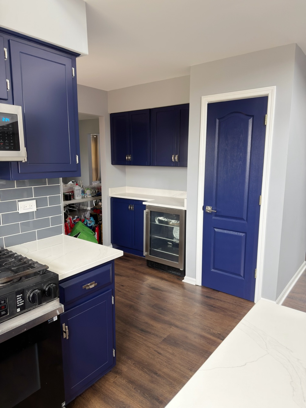 door now carries the same blue as the cabinetry