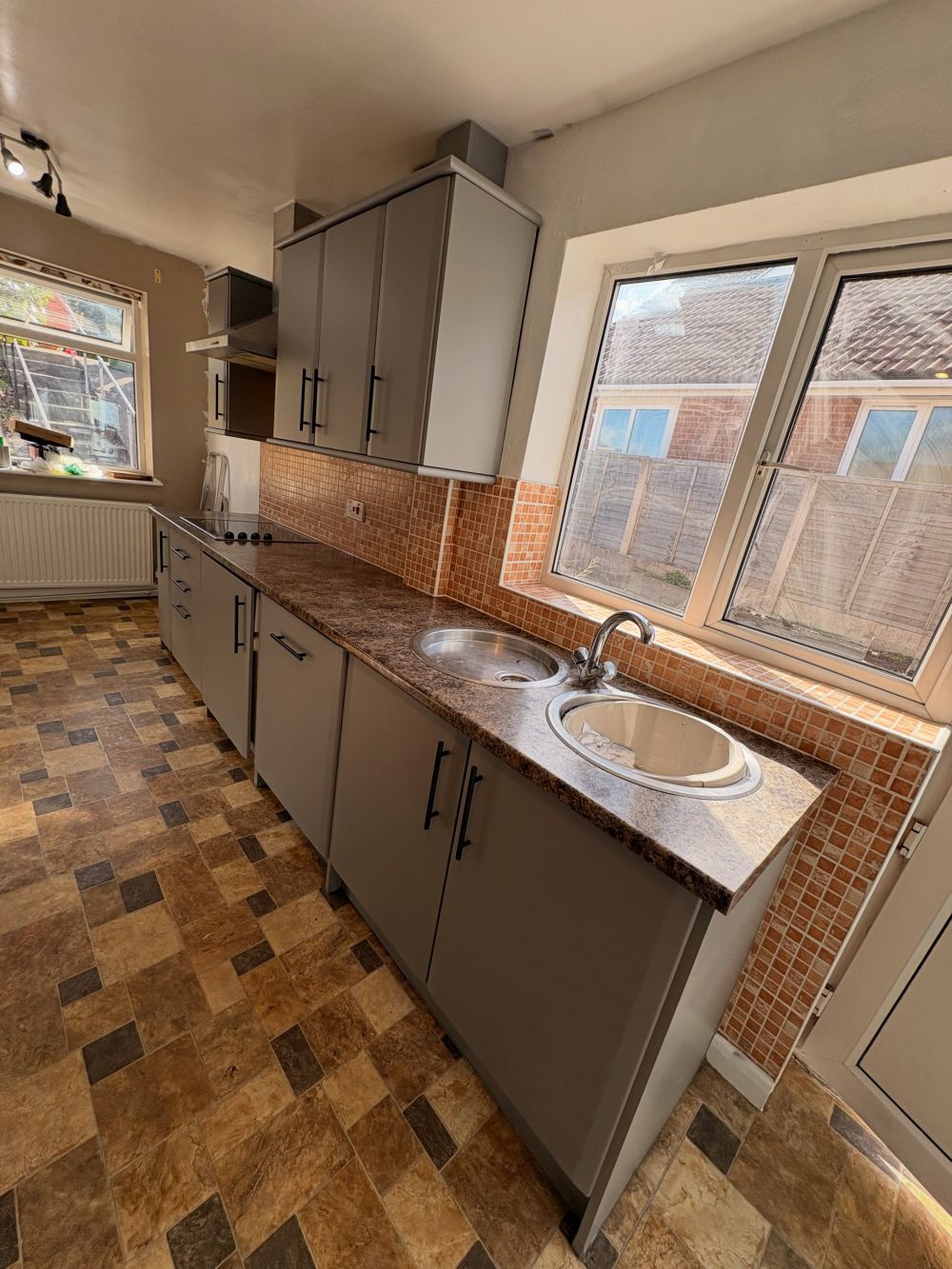 including the cabinets around the built-in oven and microwave.