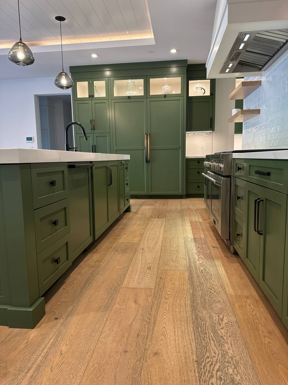 new finish continues around the stacked stainless steel wall ovens,