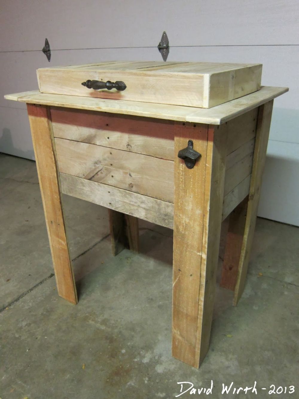 raised wooden lid sits above the serving surface