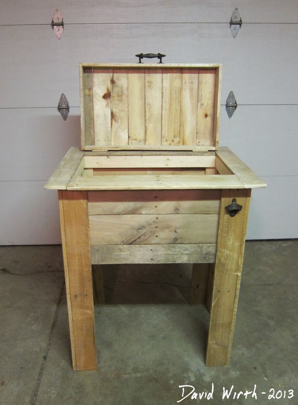 , the opening reveals the wooden enclosure beneath